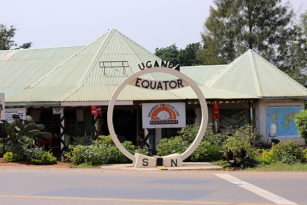Kayabwe, Uganda - January 2, 2014: A sign and a line mark where the equator passes through Uganda.