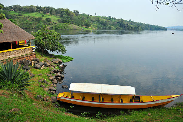 Jinja, Uganda: source of the Nile river - small boat terminal on the eastern bank of the Nile - looking downstream to the bridge - photo by M.Torres